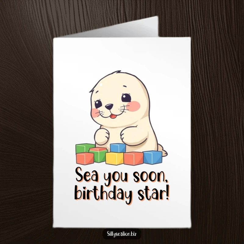Funny Free Printable Birthday Card: Cute sea lion pup joyfully sorting colorful building blocks, perfect for a playful greeting.
